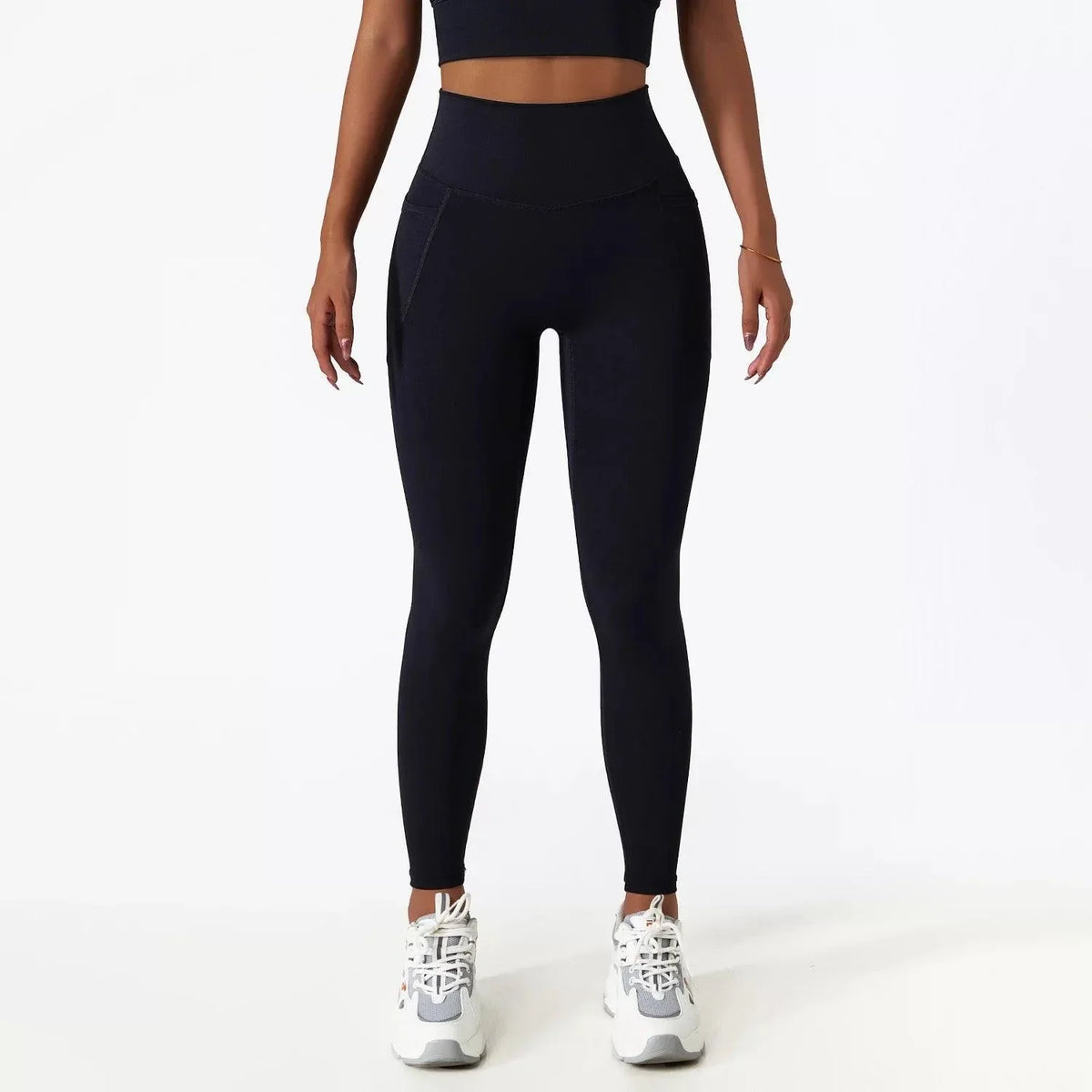 Close-up of black SECOND SKIN leggings showing the side pocket