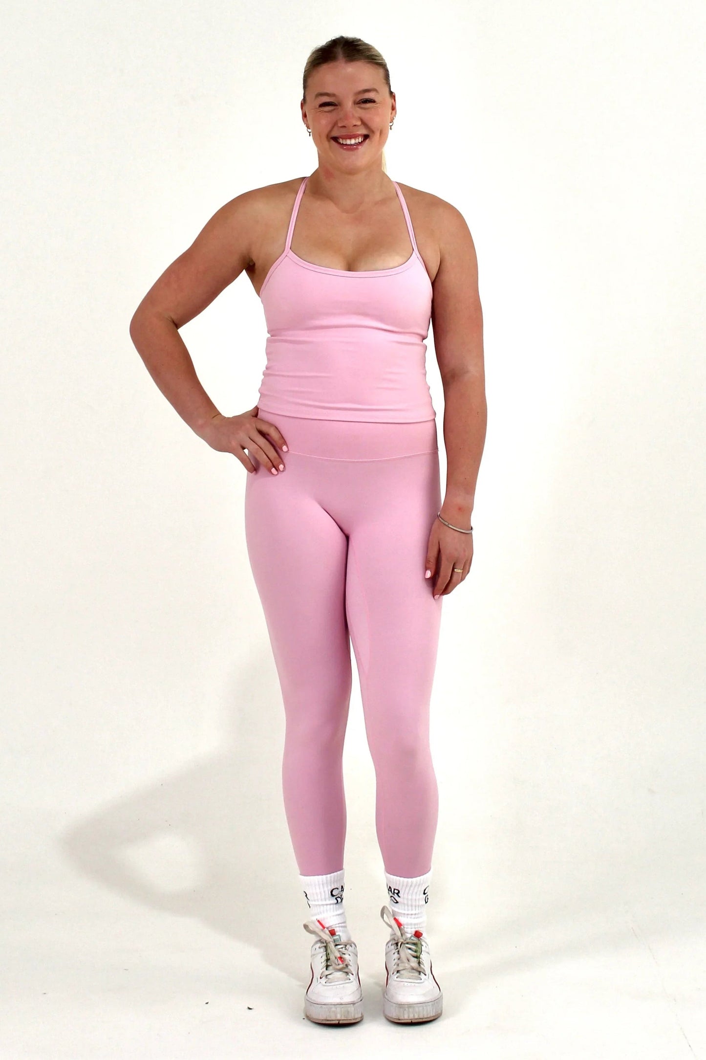 Women wearing pink Caardeo Form Leggings
