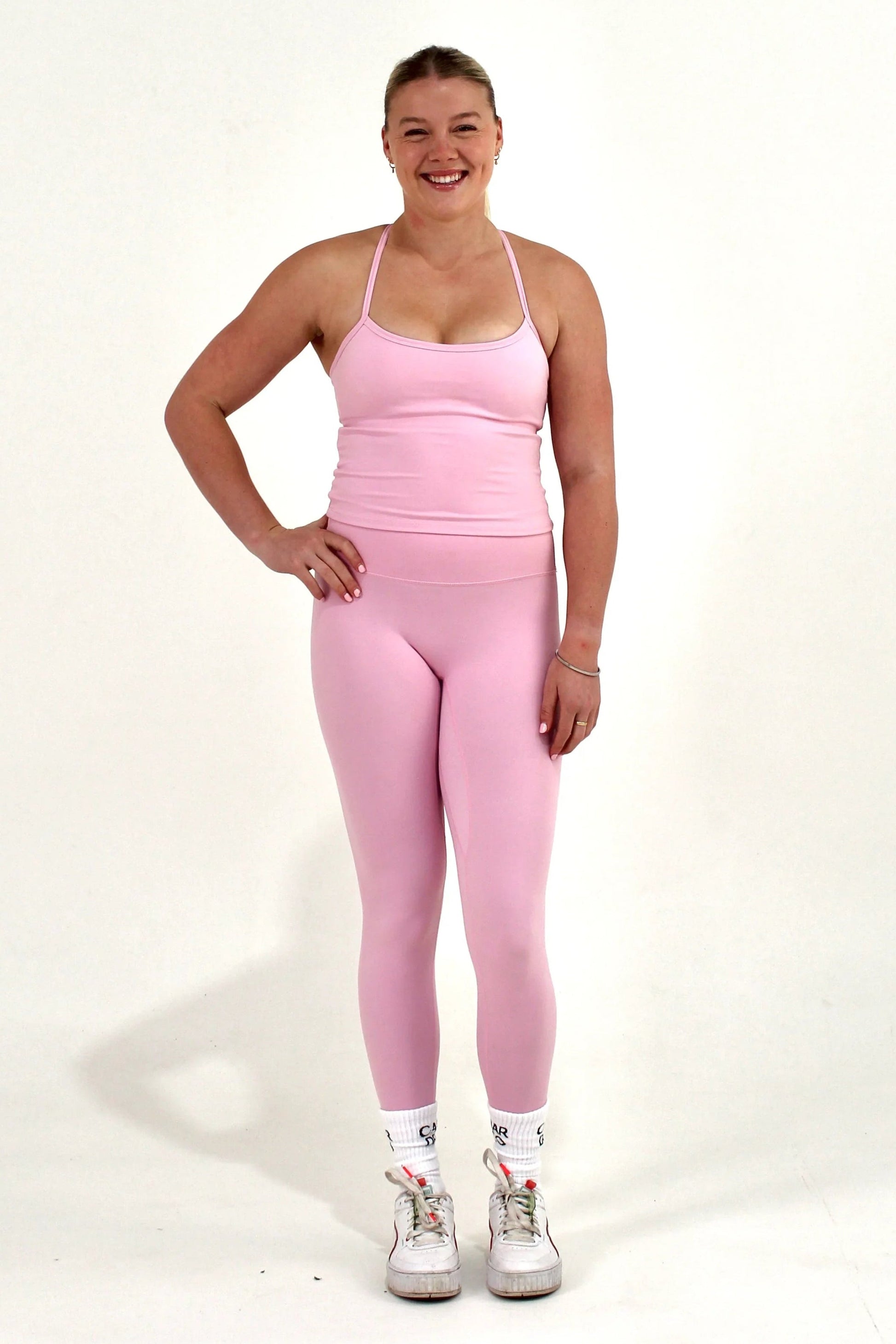 Women wearing pink Caardeo Form Leggings