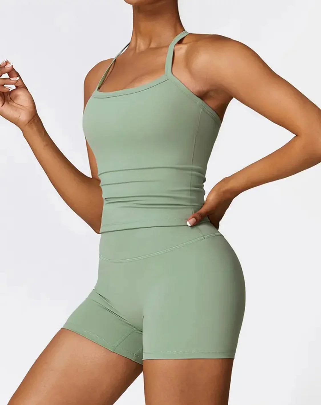 Woman wearing green FORM shorts by CAARDEO Active