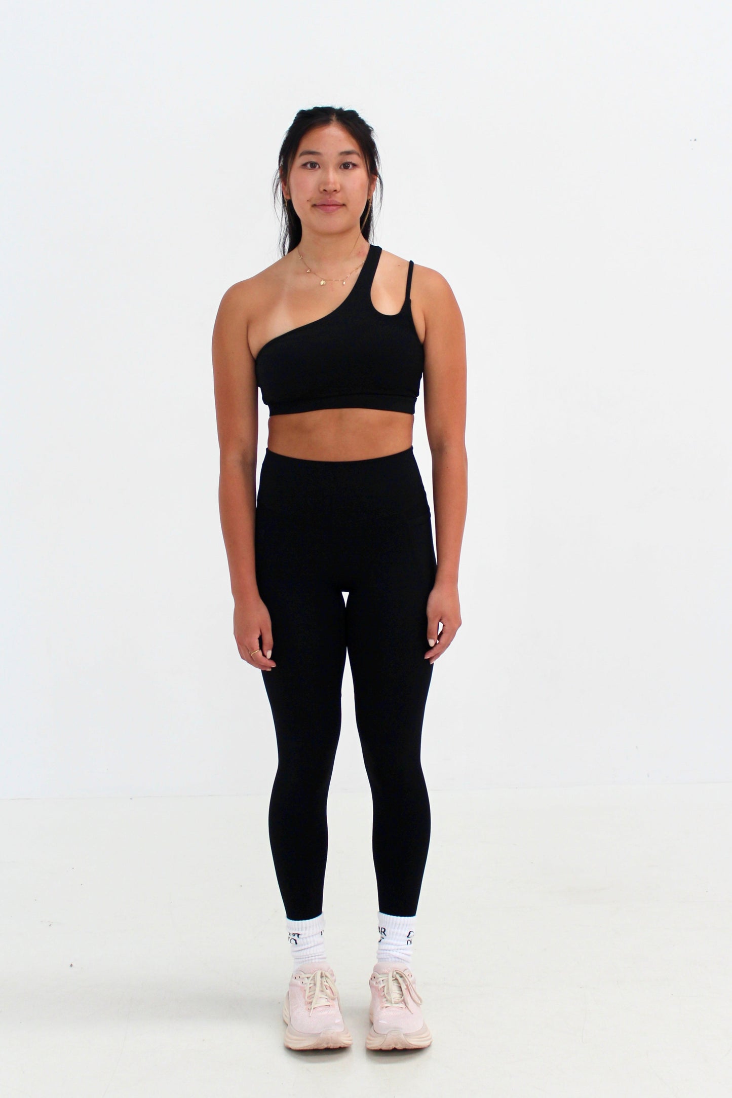 Woman wearing black SECOND SKIN leggings with side pockets by CAARDEO Active