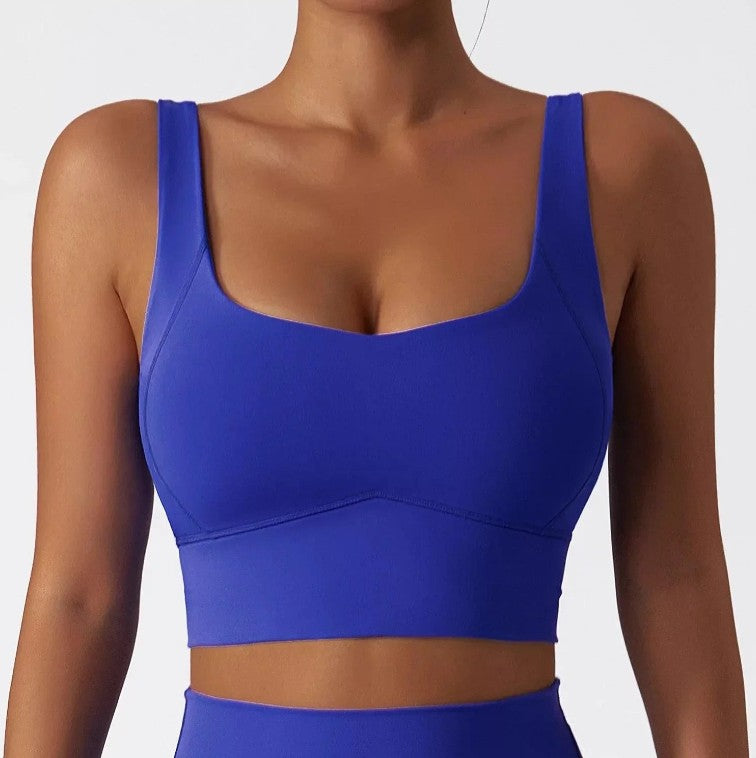 Woman wearing cobalt SECOND SKIN scoop neck crop top by CAARDEO Active