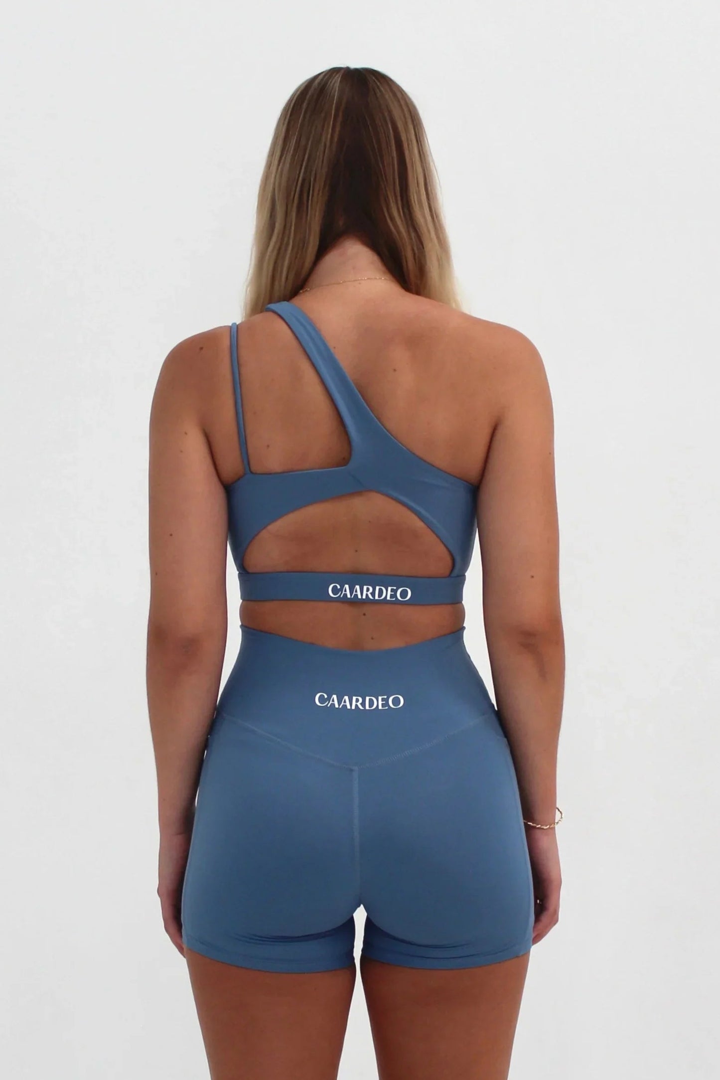 Back view of sky blue SECOND SKIN Louie crop top by CAARDEO Active