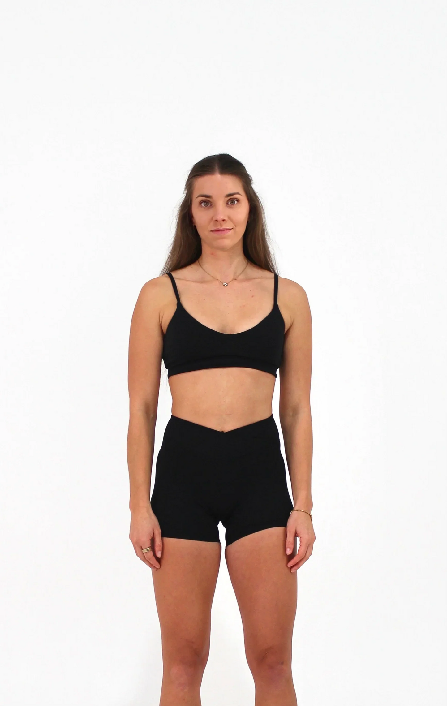 Woman wearing black ELEVATE Crop by CAARDEO Active