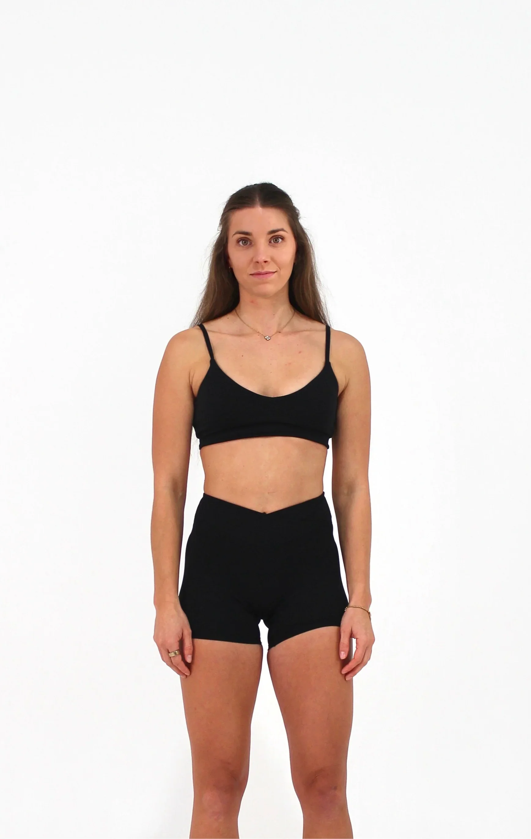 Woman wearing black ELEVATE Crop by CAARDEO Active