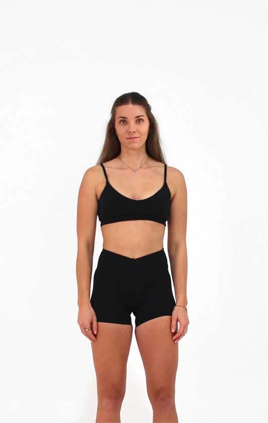 Woman wearing black ELEVATE Crop by CAARDEO Active