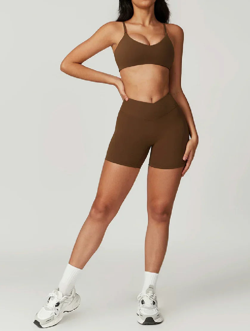 Woman wearing brown ELEVATE Shorts by CAARDEO Active