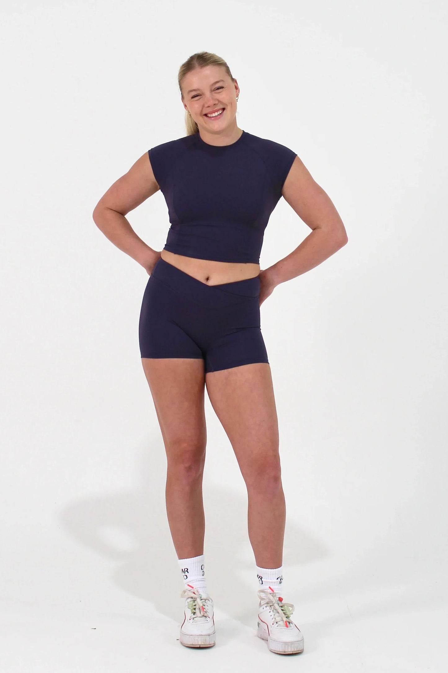Woman wearing Mauve ELEVATE Shorts by CAARDEO Active