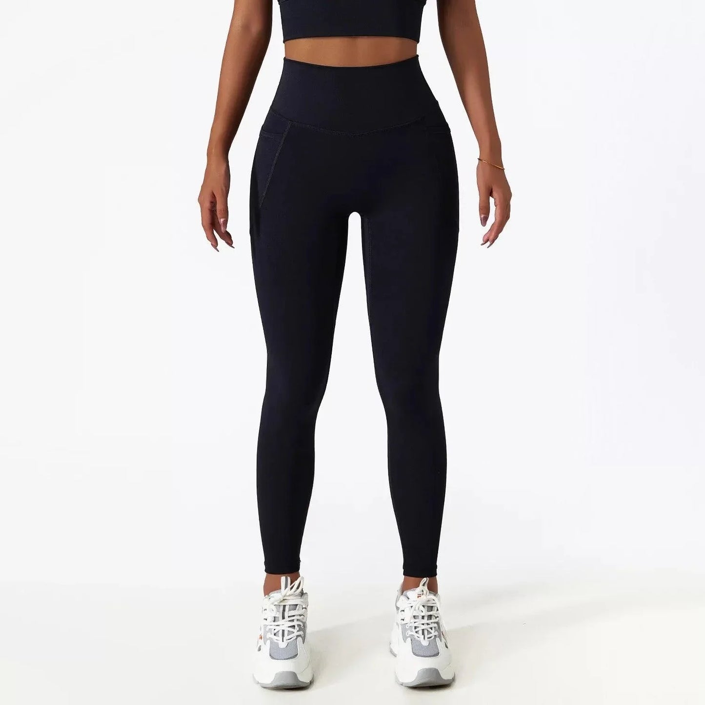 Close-up of black SECOND SKIN leggings showing the side pocket