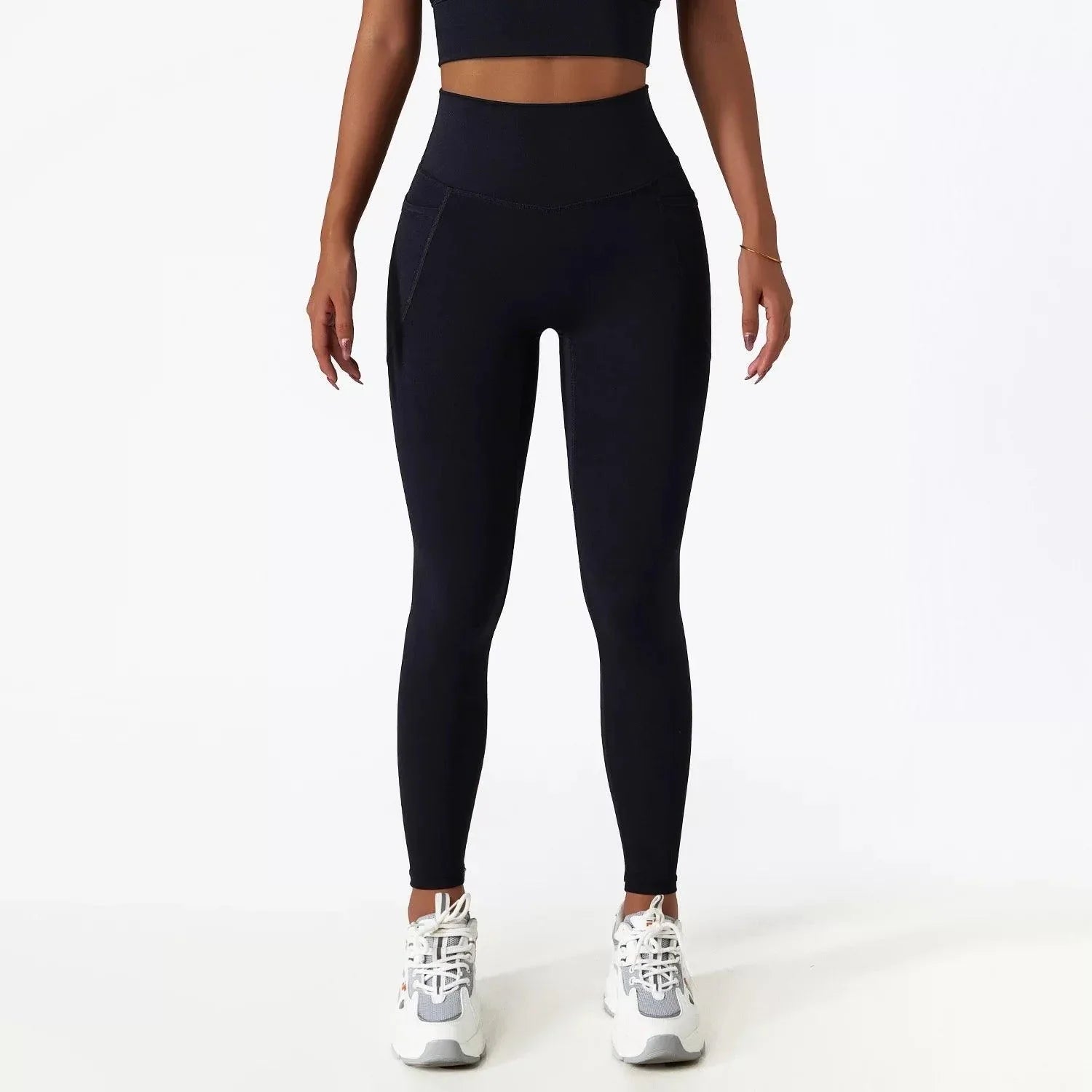 Close-up of black SECOND SKIN leggings showing the side pocket