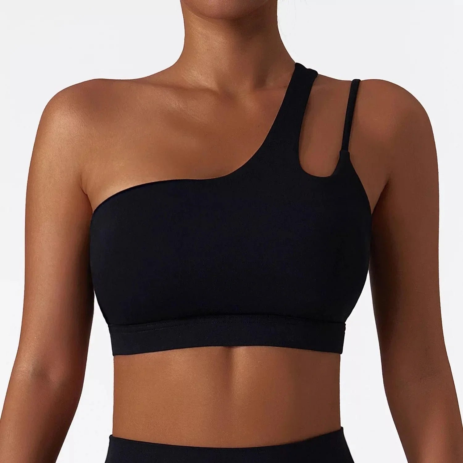 Close-up of black SECOND SKIN Louie crop top showing the asymmetric one-shoulder design